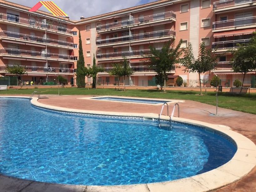Apartament amb piscina comunitària